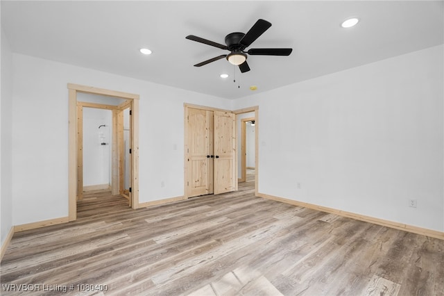 1703 E Edmondson Dr, Sallisaw, OK 74955 - unfurnished bedroom featuring wood finished floors, baseboards, recessed lighting, and ceiling fan
