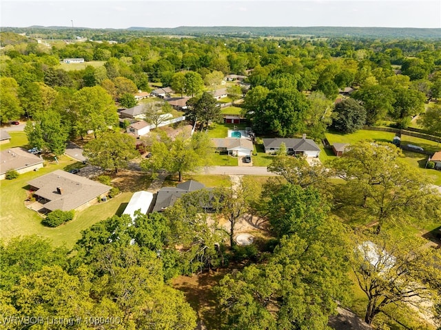 1703 E Edmondson Dr, Sallisaw, OK 74955 - aerial perspective of suburban area featuring a heavily wooded area