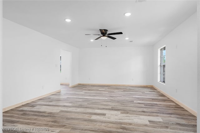 1703 E Edmondson Dr, Sallisaw, OK 74955 - unfurnished room featuring recessed lighting, light wood-style flooring, ceiling fan, and baseboards