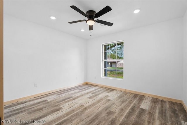 1703 E Edmondson Dr, Sallisaw, OK 74955 - spare room featuring wood finished floors, recessed lighting, baseboards, and ceiling fan