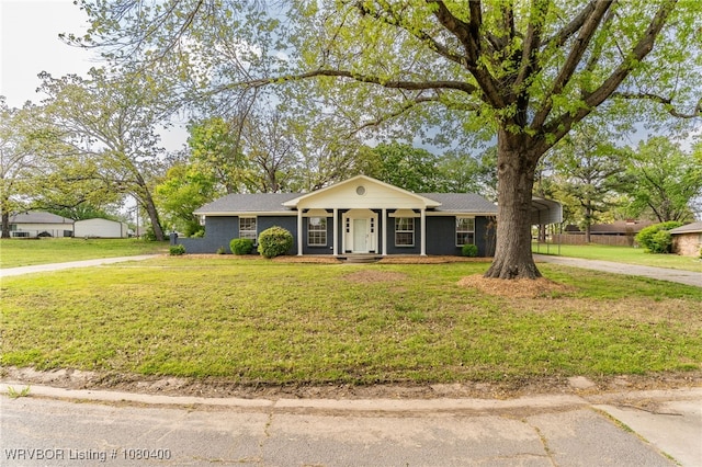 1703 E Edmondson Dr, Sallisaw, OK 74955 - single story home featuring a detached carport, a front yard, and driveway