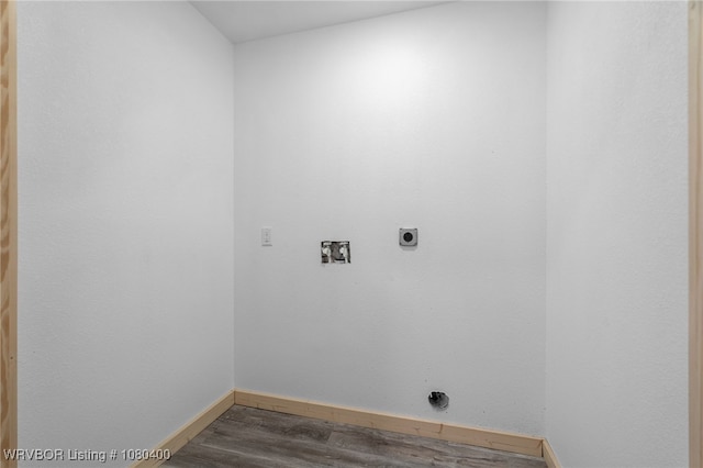 1703 E Edmondson Dr, Sallisaw, OK 74955 - washroom featuring hookup for an electric dryer, baseboards, washer hookup, and dark wood-style floors