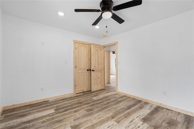 1703 E Edmondson Dr, Sallisaw, OK 74955 - unfurnished room featuring wood finished floors, ceiling fan, recessed lighting, and baseboards