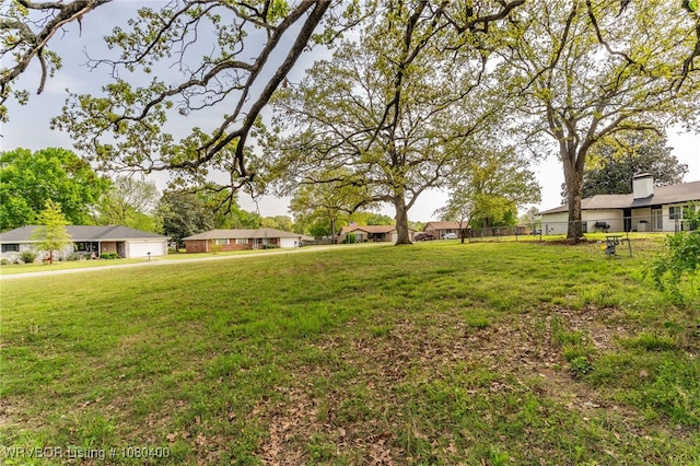 1703 E Edmondson Dr, Sallisaw, OK 74955 - view of yard featuring an attached garage