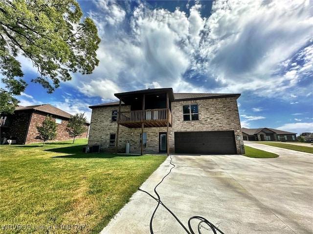 2060 W Breckenridge St, Sallisaw, OK 74955 - rear view of property with a balcony, an attached garage, stone siding, concrete driveway, and a yard