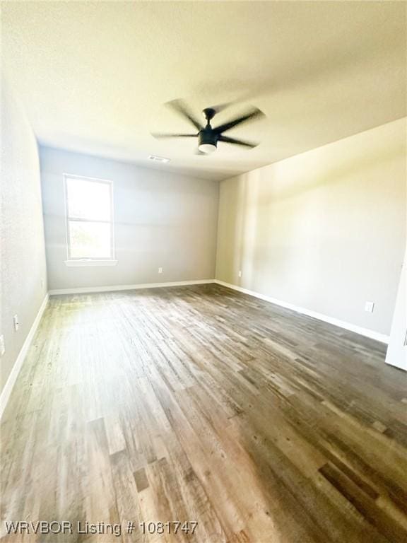 2060 W Breckenridge St, Sallisaw, OK 74955 - spare room featuring wood finished floors and ceiling fan