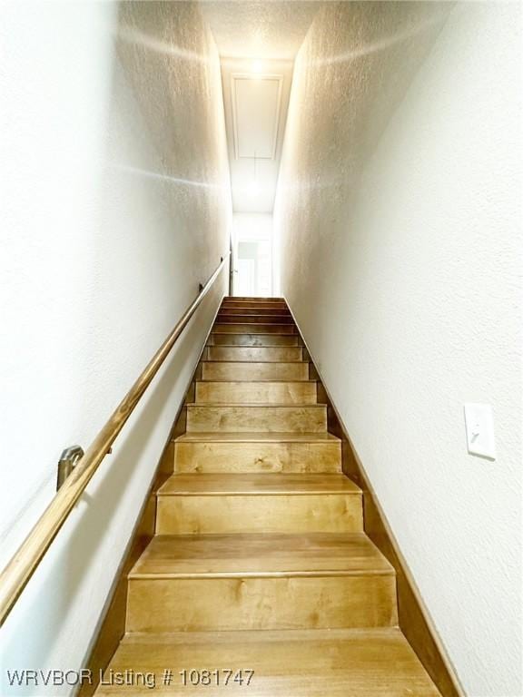 2060 W Breckenridge St, Sallisaw, OK 74955 - staircase featuring attic access and a textured wall