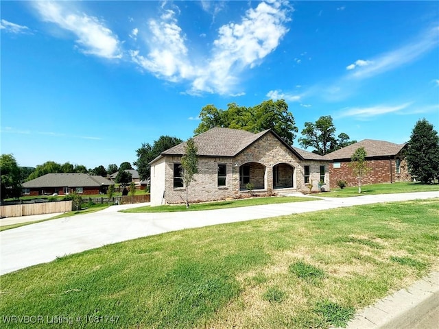 2060 W Breckenridge St, Sallisaw, OK 74955 - view of front of house featuring curved driveway, brick siding, and roof with shingles