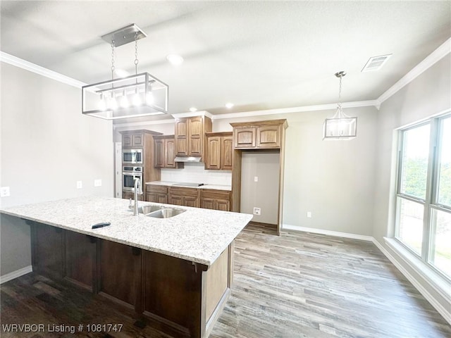 2060 W Breckenridge St, Sallisaw, OK 74955 - kitchen featuring stainless steel appliances, crown molding, healthy amount of natural light, light stone countertops, and light wood-type flooring