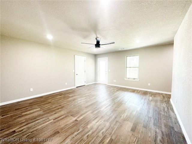 2060 W Breckenridge St, Sallisaw, OK 74955 - spare room featuring ceiling fan, wood finished floors, and a textured ceiling