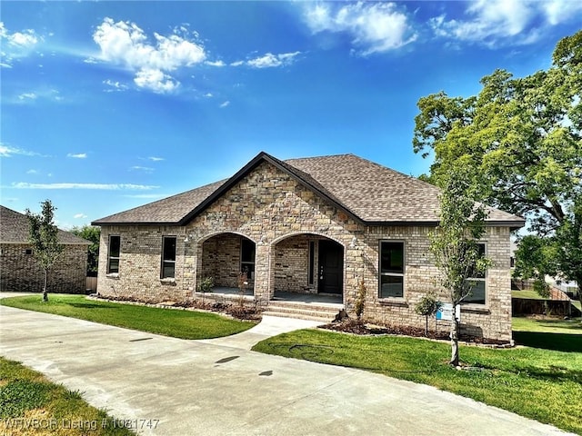 2060 W Breckenridge St, Sallisaw, OK 74955 - view of front of house with covered porch, a front lawn, brick siding, and roof with shingles