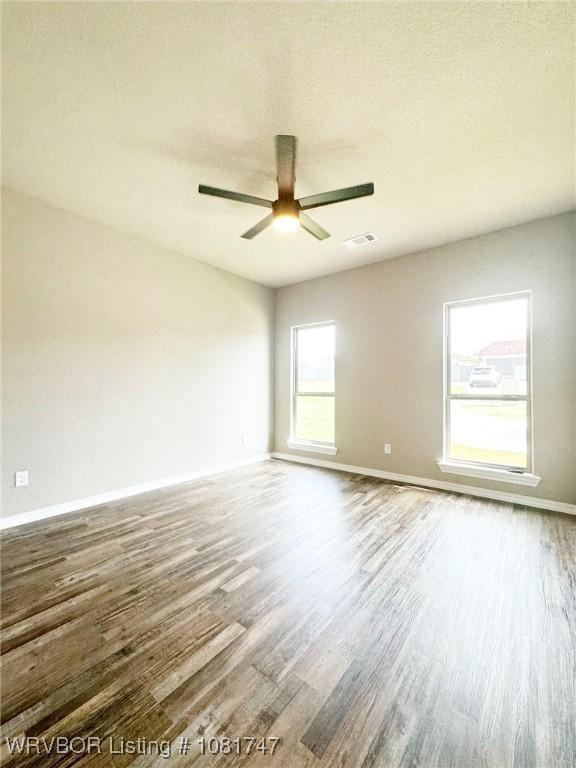 2060 W Breckenridge St, Sallisaw, OK 74955 - spare room with wood finished floors and ceiling fan