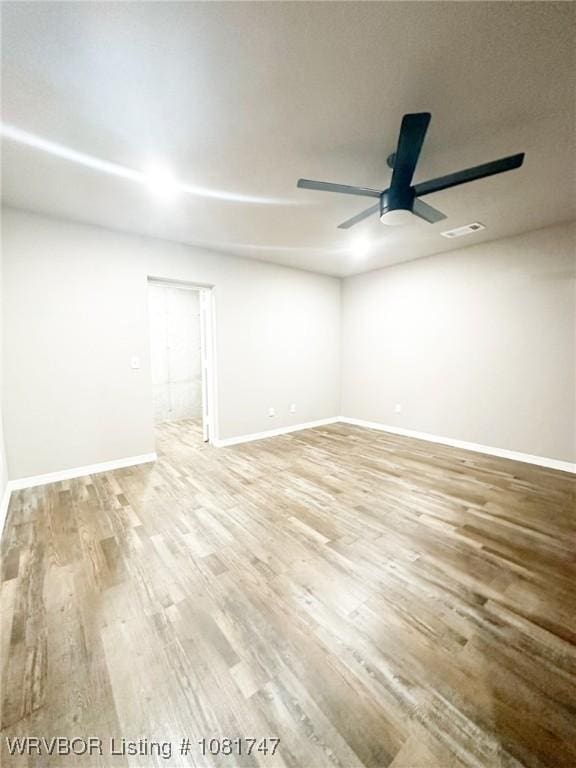 2060 W Breckenridge St, Sallisaw, OK 74955 - empty room featuring wood finished floors and a ceiling fan