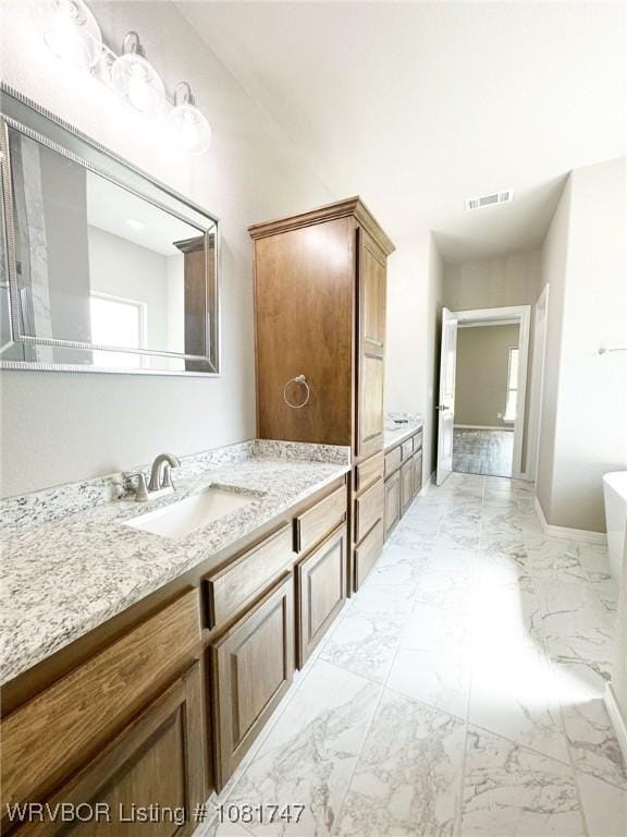 2060 W Breckenridge St, Sallisaw, OK 74955 - full bathroom featuring a freestanding tub, vanity, and marble finish flooring