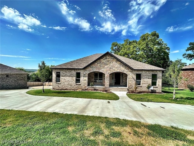 2060 W Breckenridge St, Sallisaw, OK 74955 - view of front of home with a front lawn, a porch, and brick siding
