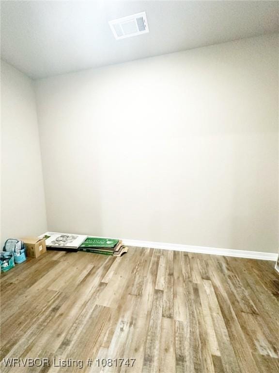 2060 W Breckenridge St, Sallisaw, OK 74955 - unfurnished room featuring wood finished floors and baseboards