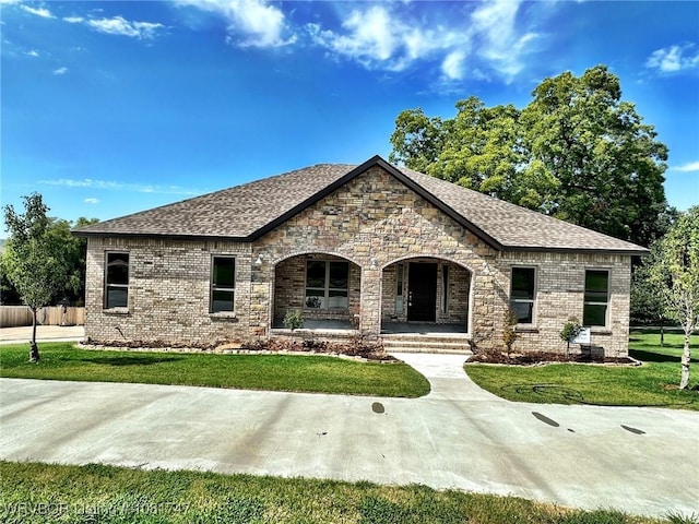 2060 W Breckenridge St, Sallisaw, OK 74955 - french provincial home with a porch, roof with shingles, and brick siding