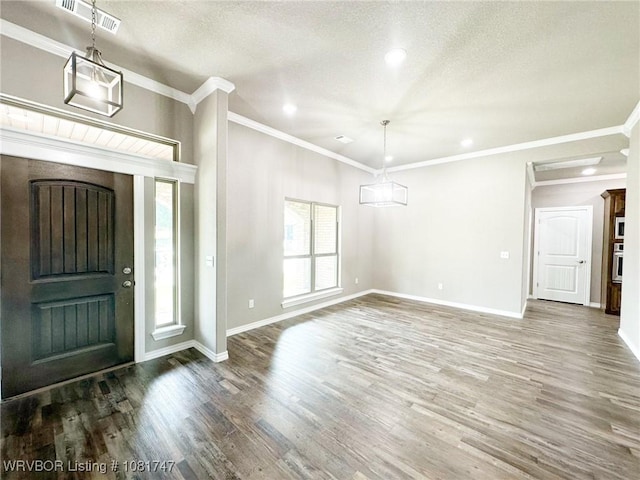 2060 W Breckenridge St, Sallisaw, OK 74955 - entrance foyer with wood finished floors, recessed lighting, crown molding, and a textured ceiling