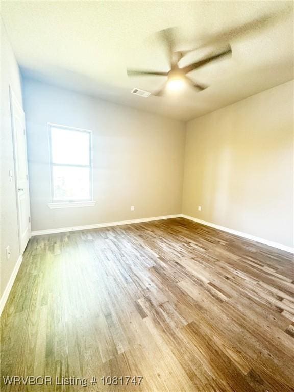 2060 W Breckenridge St, Sallisaw, OK 74955 - unfurnished room with wood finished floors and a ceiling fan