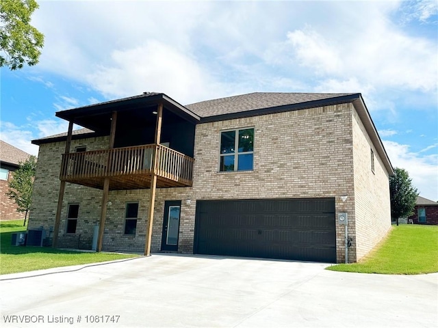 2060 W Breckenridge St, Sallisaw, OK 74955 - view of front of property with an attached garage, brick siding, driveway, a front lawn, and a balcony