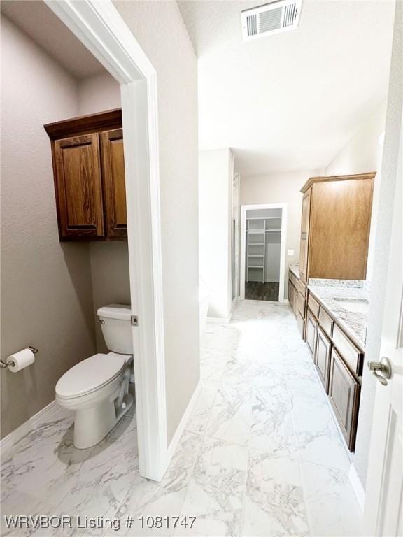 2060 W Breckenridge St, Sallisaw, OK 74955 - full bathroom with marble look tiles, vanity, and a shower