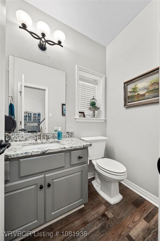 9301 Canopy Oaks Dr, Fort Smith, AR 72903 - bathroom featuring wood finished floors and vanity
