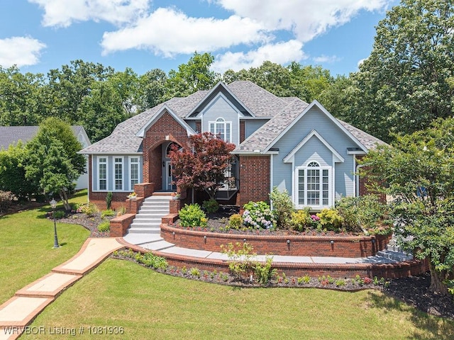 9301 Canopy Oaks Dr, Fort Smith, AR 72903 - view of front of property featuring a front yard, brick siding, and roof with shingles