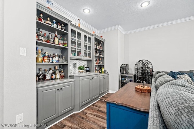 9301 Canopy Oaks Dr, Fort Smith, AR 72903 - indoor dry bar featuring ornamental molding, a textured ceiling, dark wood-style floors, and wine cooler