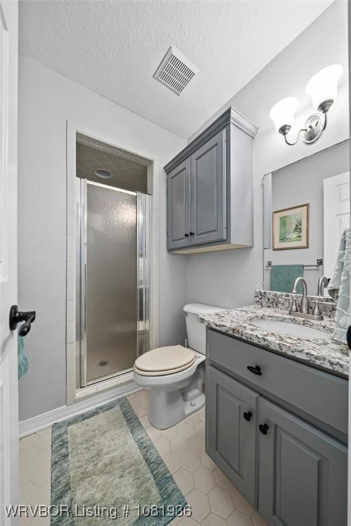 9301 Canopy Oaks Dr, Fort Smith, AR 72903 - full bathroom featuring vanity, a stall shower, tile patterned floors, and a textured ceiling