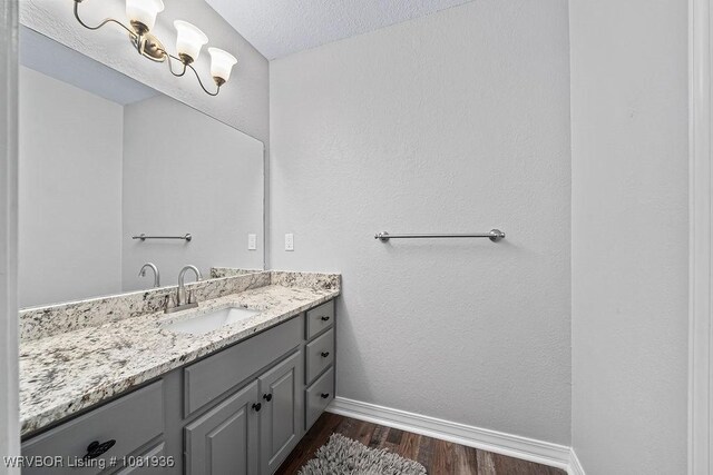 9301 Canopy Oaks Dr, Fort Smith, AR 72903 - bathroom featuring wood finished floors and vanity