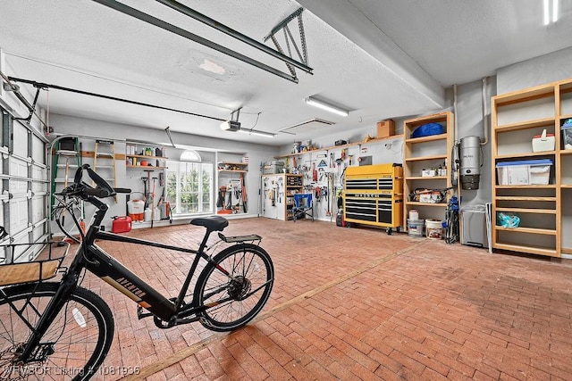 9301 Canopy Oaks Dr, Fort Smith, AR 72903 - garage with a garage door opener and a central vacuum unit