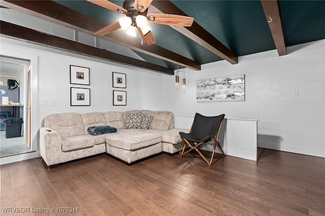 living room featuring hardwood / wood-style floors, lofted ceiling with beams, and ceiling fan