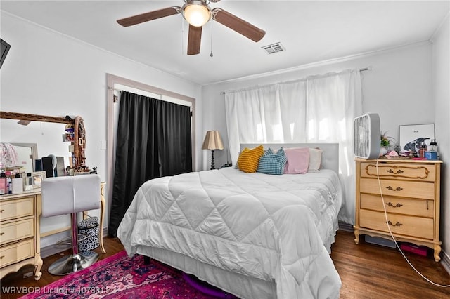 bedroom with ceiling fan and dark hardwood / wood-style floors