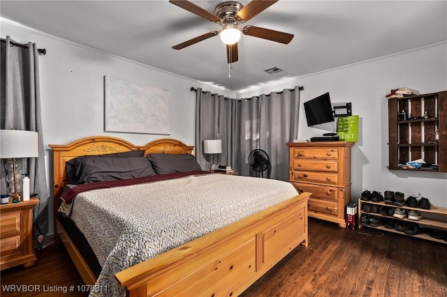 bedroom featuring ceiling fan and dark wood-type flooring