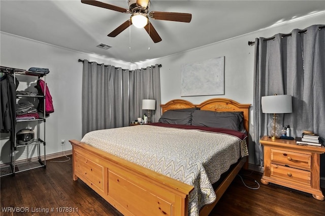 bedroom featuring dark hardwood / wood-style floors and ceiling fan