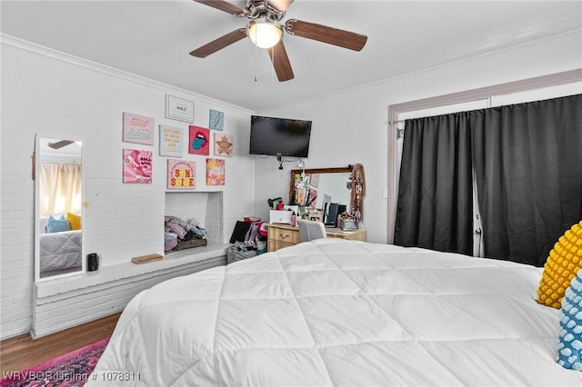 bedroom with ceiling fan and hardwood / wood-style flooring