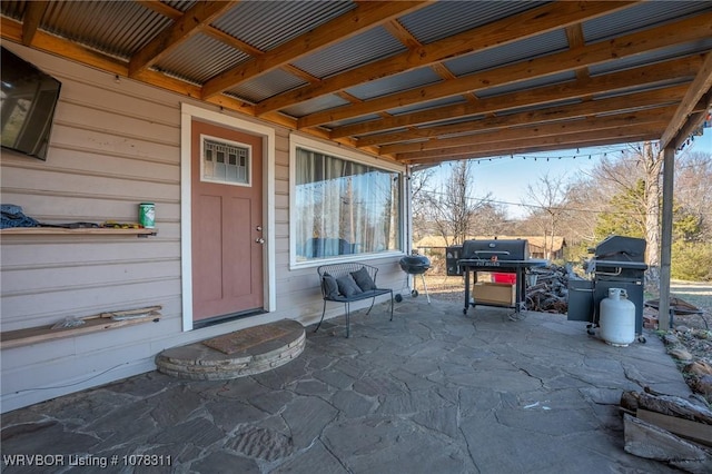 doorway to property with a patio area