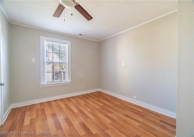 unfurnished room with ceiling fan, crown molding, and light hardwood / wood-style flooring