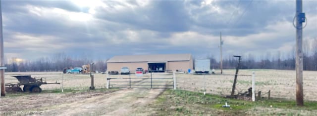 view of yard with an outbuilding, a gate, and fence