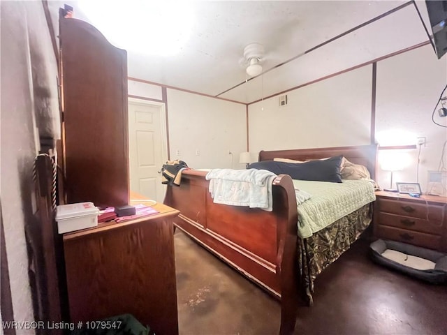 bedroom with concrete floors and a ceiling fan