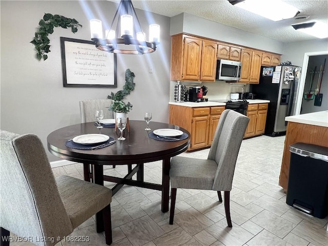 801 Northview Dr, Van Buren, AR 72956 - dining room with a chandelier and a textured ceiling
