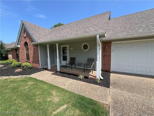 801 Northview Dr, Van Buren, AR 72956 - view of front of property featuring a shingled roof, a porch, brick siding, and an attached garage