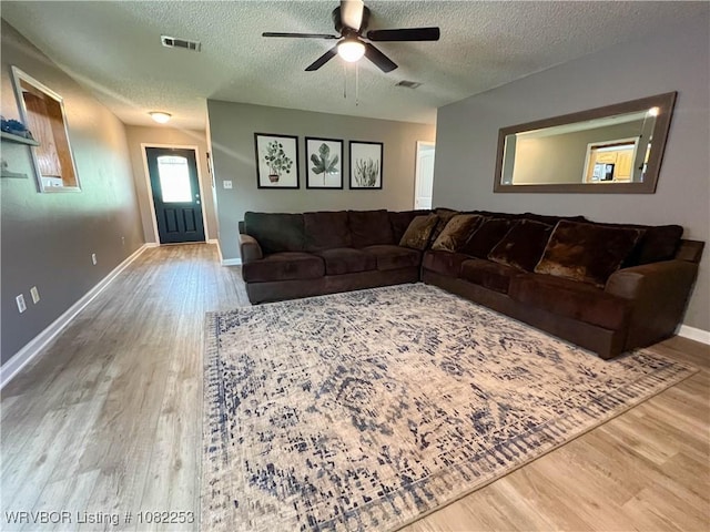 801 Northview Dr, Van Buren, AR 72956 - living area with wood finished floors, a textured ceiling, and a ceiling fan