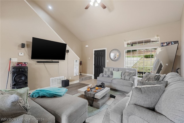 living room featuring hardwood / wood-style floors and ceiling fan