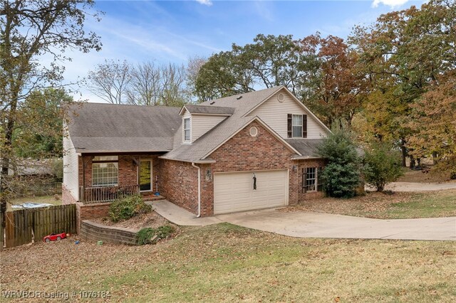 view of property with a front yard and a garage