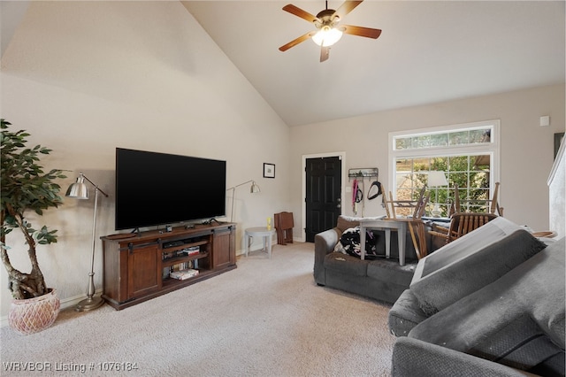 living room with light carpet, ceiling fan, and high vaulted ceiling