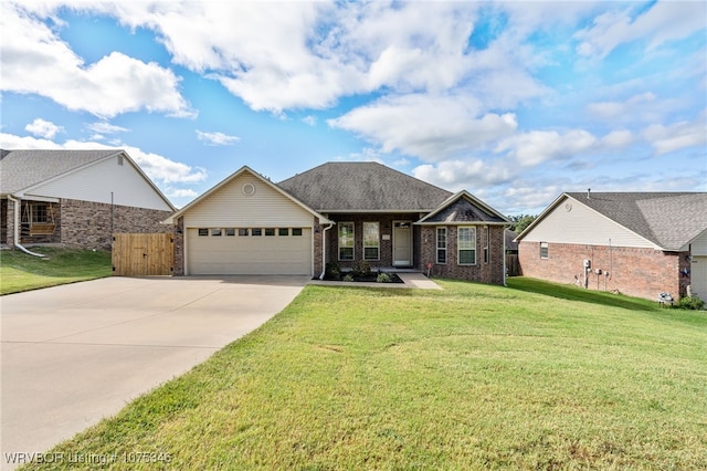 view of front of property with a garage and a front lawn