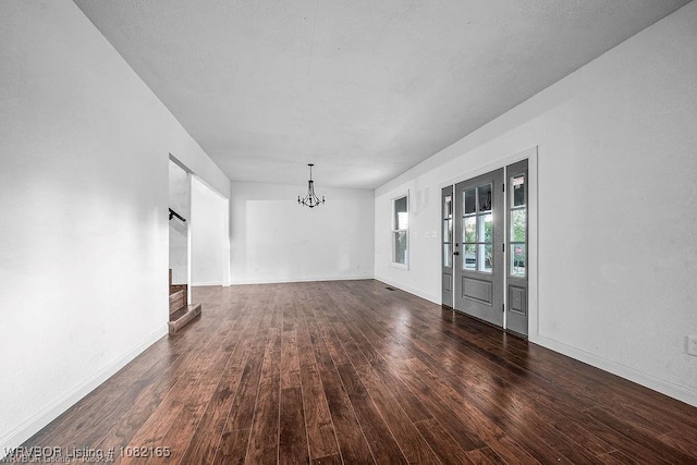 802 N 11th St, Van Buren, AR 72956 - unfurnished room with wood finished floors and a chandelier