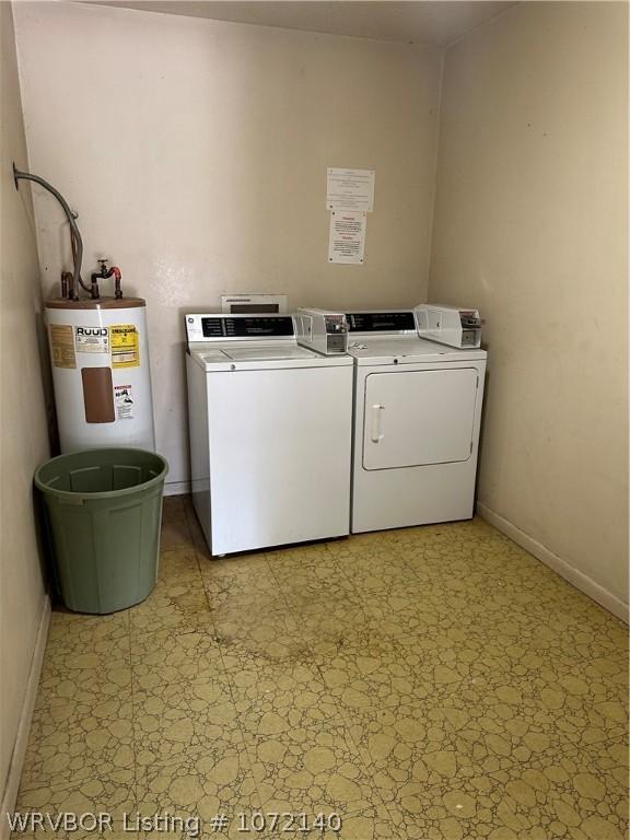 laundry room featuring washer and clothes dryer and water heater