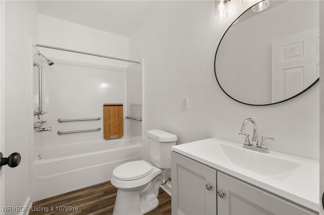 full bath featuring tub / shower combination, vanity, toilet, and wood finished floors